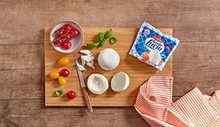 tagliare le mozzarelle in due metà