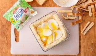 coprire con le fette di mozzarella Light Santa Lucia coprire con le fette di mozzarella Light Santa Lucia