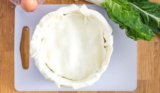 ricoprire con un altro strato di pasta sfoglia ricoprire con un altro strato di pasta sfoglia